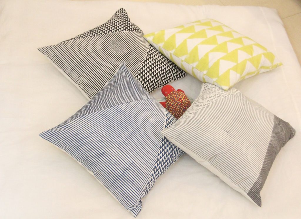 Assortment of hand block printed organic cotton cushion covers styled together | Myyra Jaipur