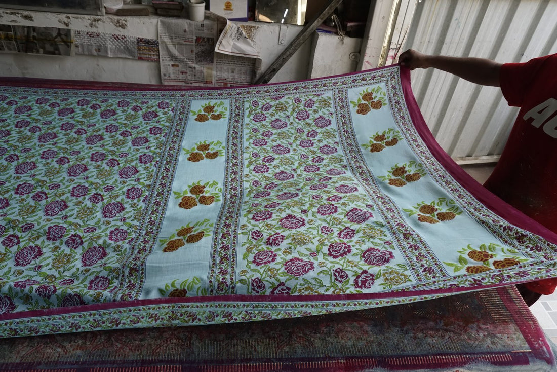 Hand block printed floral saree in process on the printing table | Myyra Jaipur