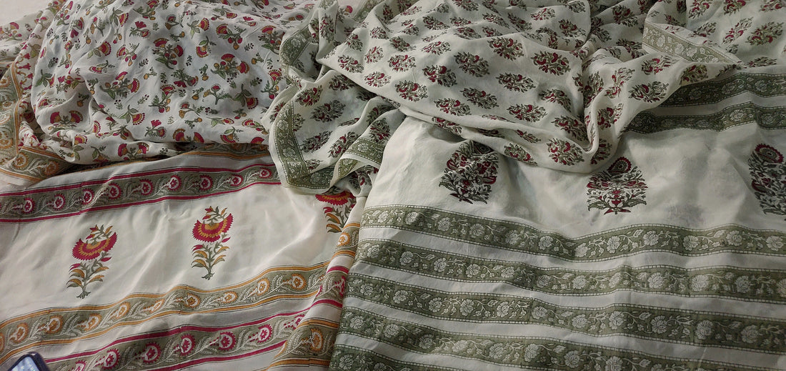 GOTS-certified hand block printed organic cotton fabric in red and green floral motifs from Myyra Jaipur