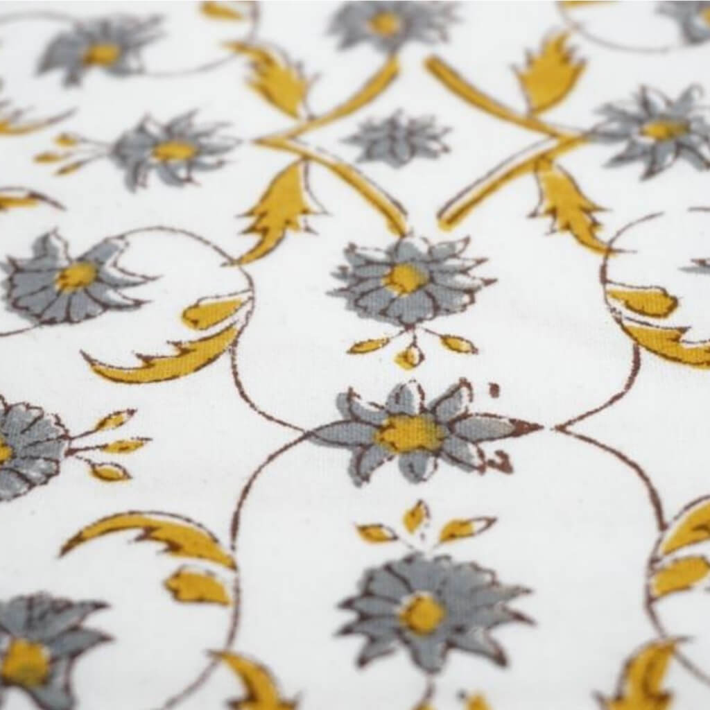 Close-up of hand block print on organic cotton running fabric | Myyra Jaipur