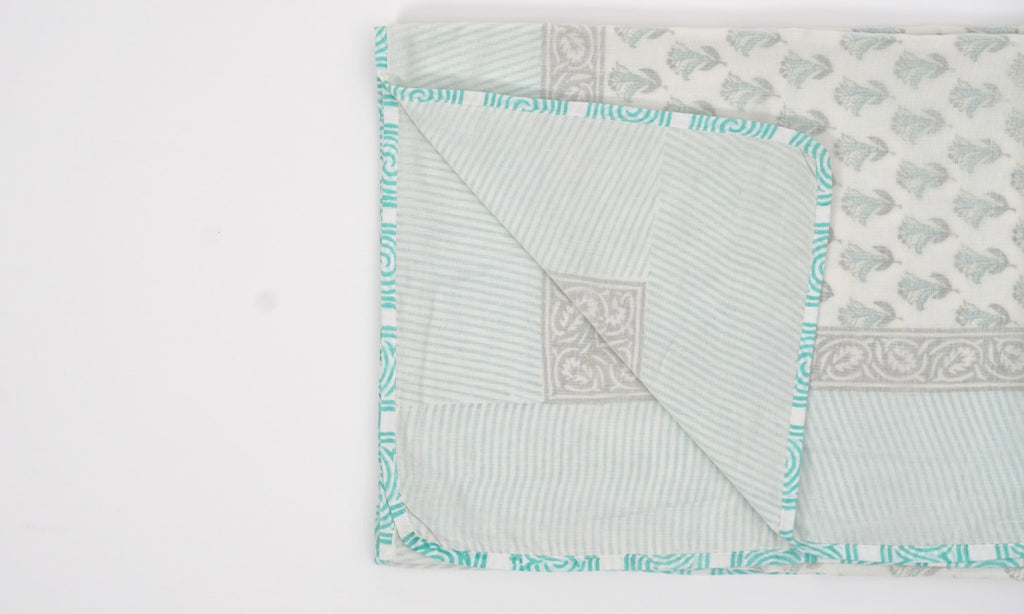 Dohar (lightweight cotton quilt) folded showing pattern repeat of hand block print | Myyra Jaipur