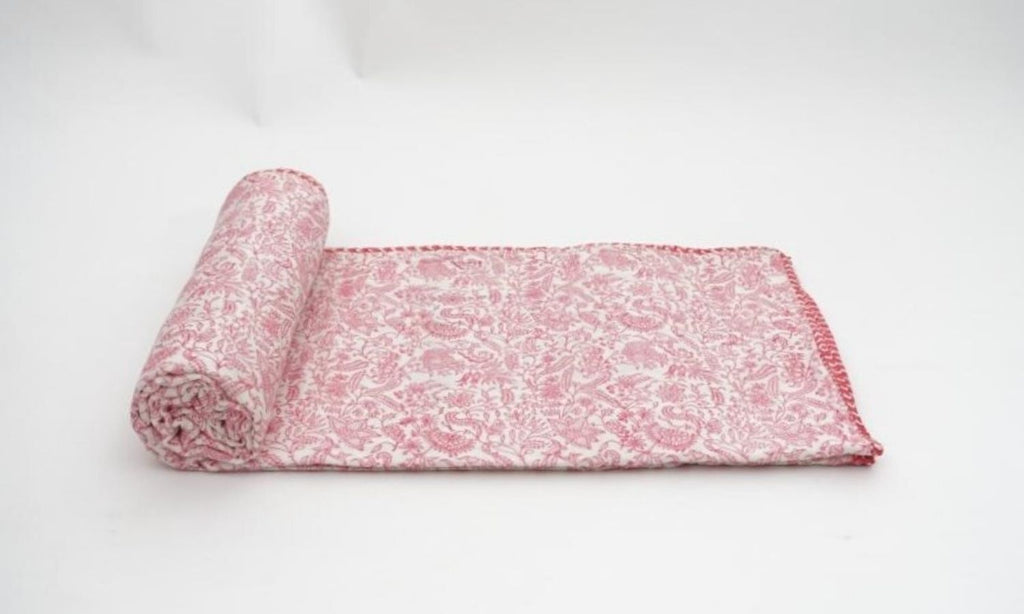 Dohar (lightweight cotton quilt) folded showing pattern repeat of hand block print | Myyra Jaipur