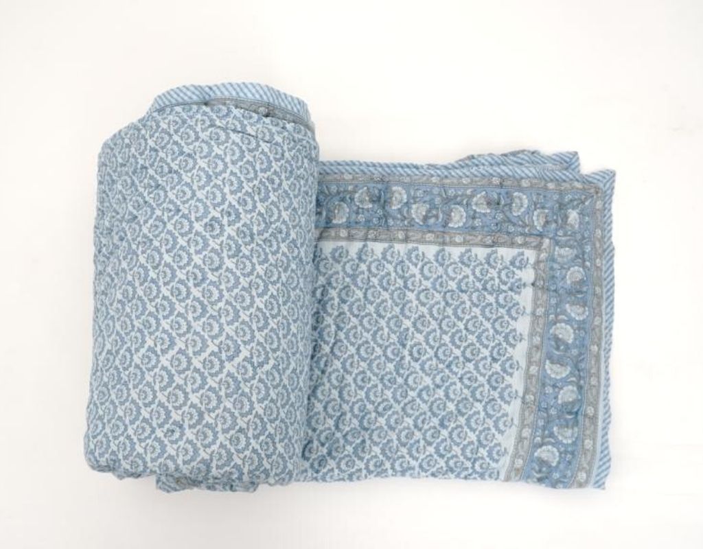 Styled view of hand block printed organic cotton quilt | Myyra Jaipur