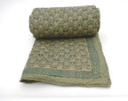 Styled view of hand block printed organic cotton quilt | Myyra Jaipur