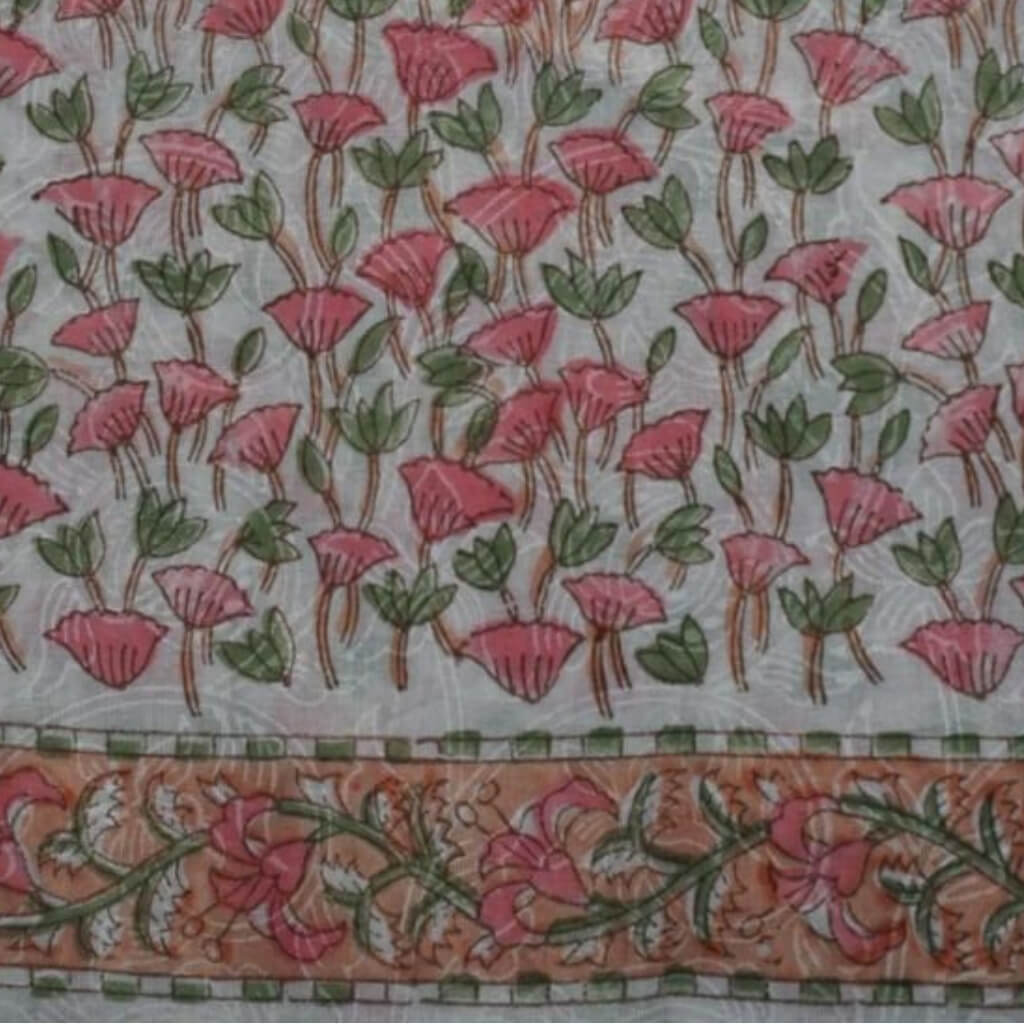 Folded hand block printed organic cotton yardage showing pattern repeat | Myyra Jaipur