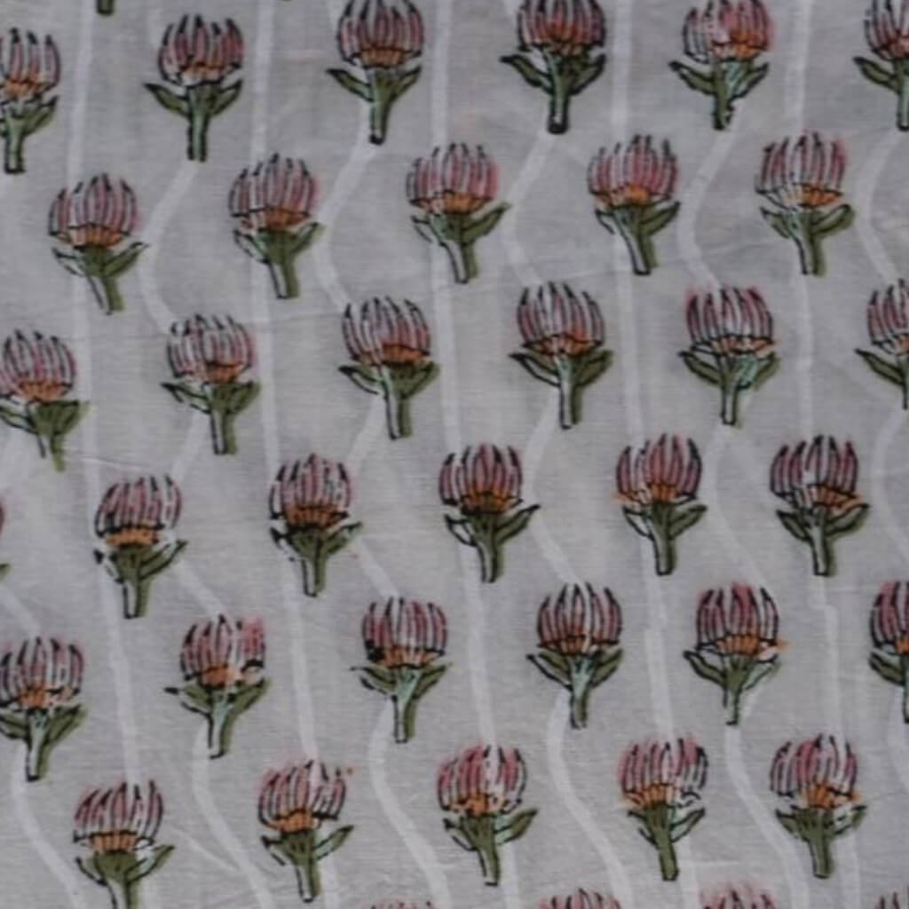 Hand block printed organic cotton fabric in styled flat lay | Myyra Jaipur