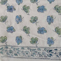 Hand block printed organic cotton fabric in styled flat lay | Myyra Jaipur