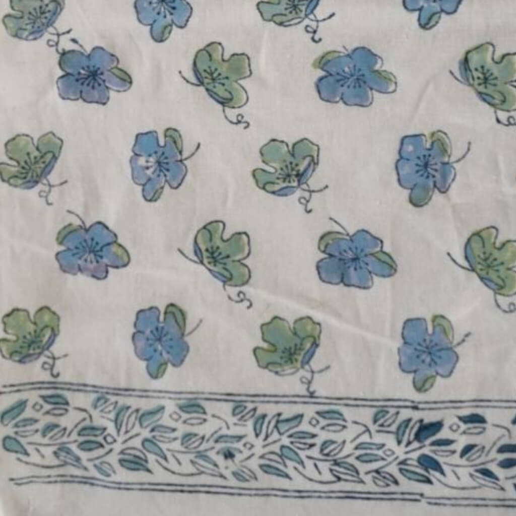 Hand block printed organic cotton fabric in styled flat lay | Myyra Jaipur