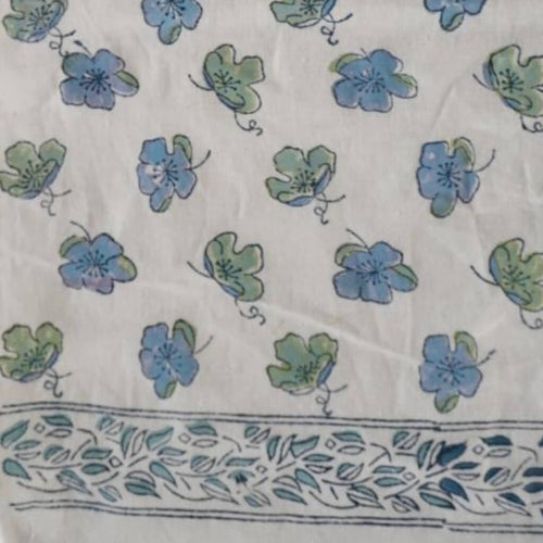 Hand block printed organic cotton fabric in styled flat lay | Myyra Jaipur
