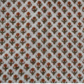 Folded hand block printed organic cotton yardage showing pattern repeat | Myyra Jaipur