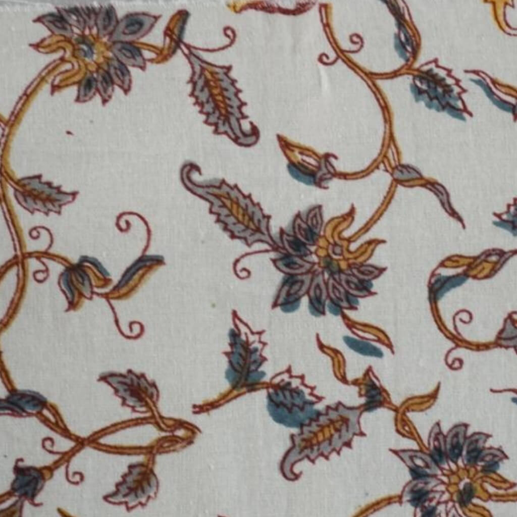 Hand block printed organic cotton fabric in styled flat lay | Myyra Jaipur