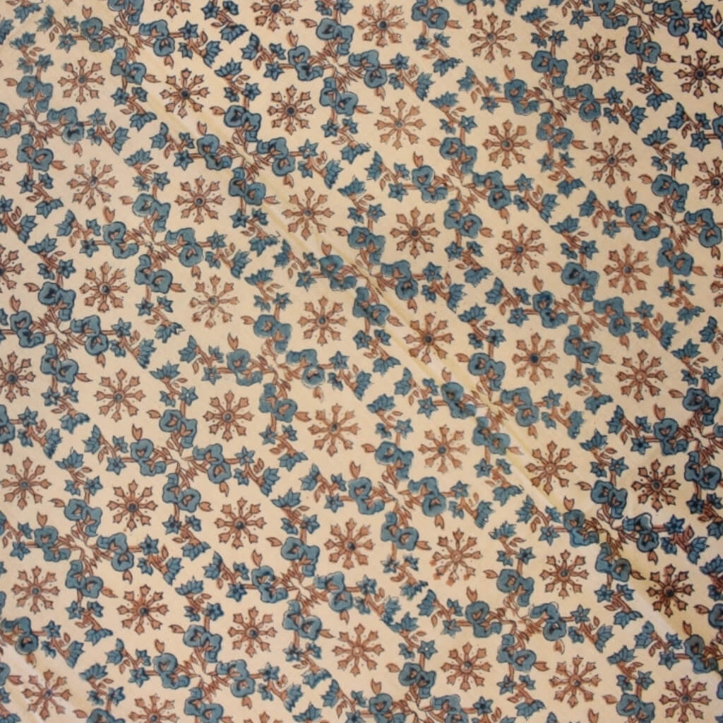 Close-up of hand block print on organic cotton running fabric | Myyra Jaipur