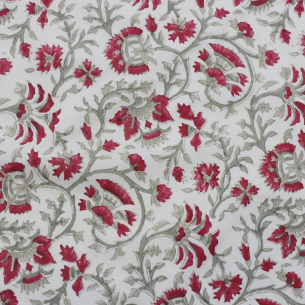 Folded hand block printed organic cotton yardage showing pattern repeat | Myyra Jaipur
