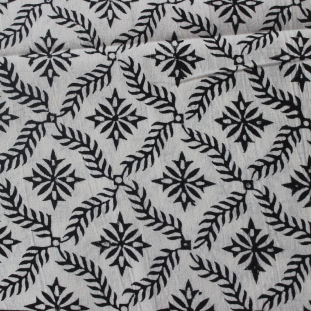 Close-up of hand block print on organic cotton running fabric | Myyra Jaipur