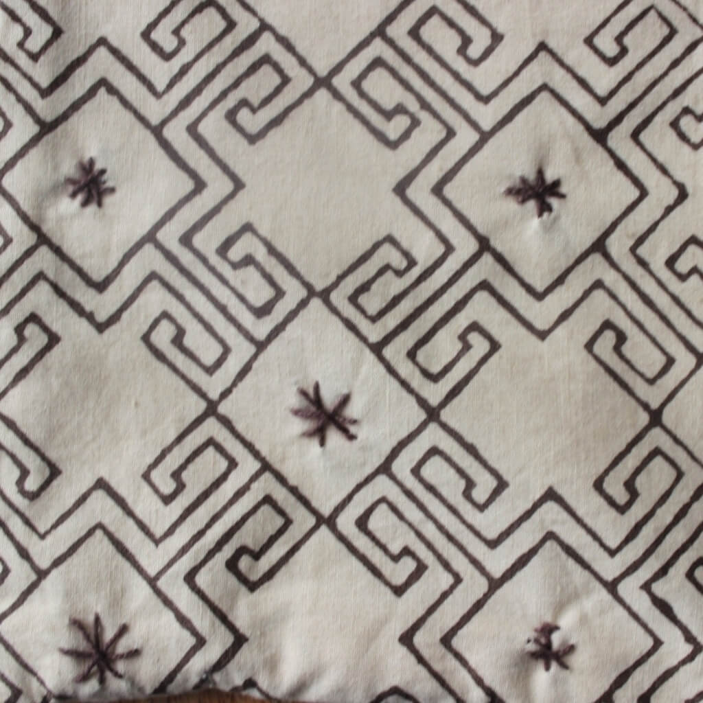 Close-up of hand block print on organic cotton running fabric | Myyra Jaipur