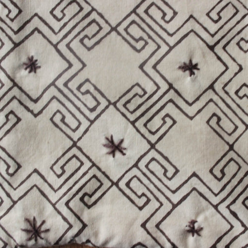 Close-up of hand block print on organic cotton running fabric | Myyra Jaipur