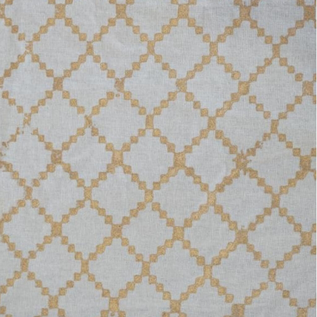 Folded hand block printed organic cotton yardage showing pattern repeat | Myyra Jaipur