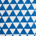 Folded hand block printed organic cotton yardage showing pattern repeat | Myyra Jaipur