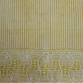 Hand block printed organic cotton fabric in styled flat lay | Myyra Jaipur