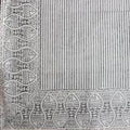 Folded hand block printed organic cotton yardage showing pattern repeat | Myyra Jaipur