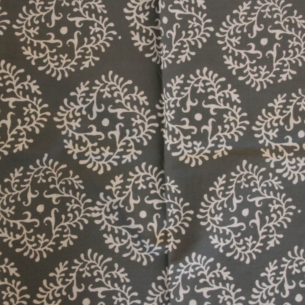 Hand block printed organic cotton fabric in styled flat lay | Myyra Jaipur