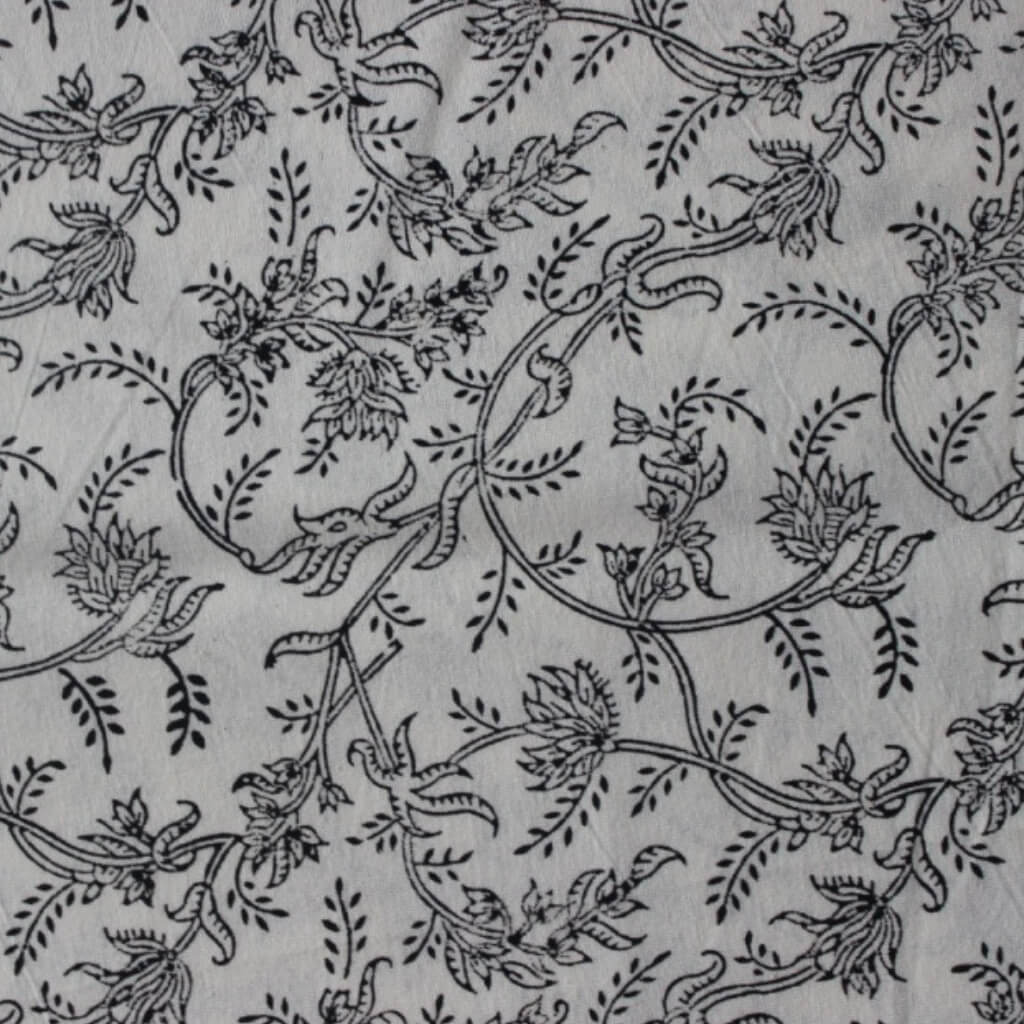 Hand block printed organic cotton fabric in styled flat lay | Myyra Jaipur