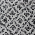 Folded hand block printed organic cotton yardage showing pattern repeat | Myyra Jaipur