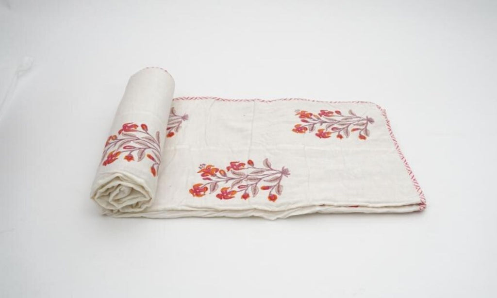 Dohar (lightweight cotton quilt) folded showing pattern repeat of hand block print | Myyra Jaipur