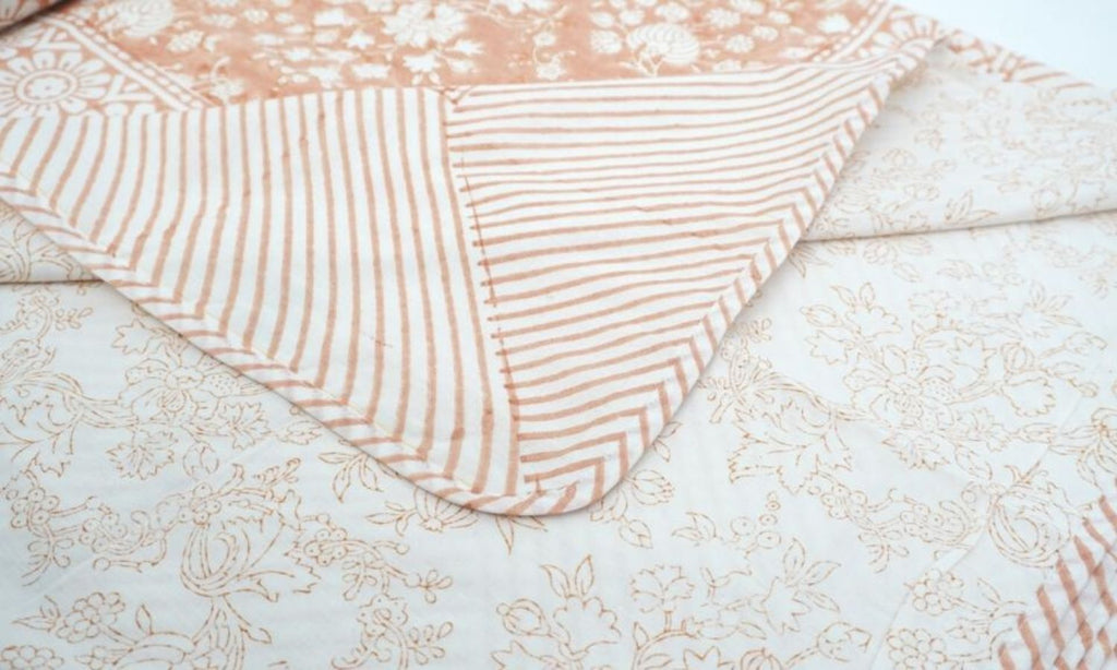 Dohar (lightweight cotton quilt) folded showing pattern repeat of hand block print | Myyra Jaipur