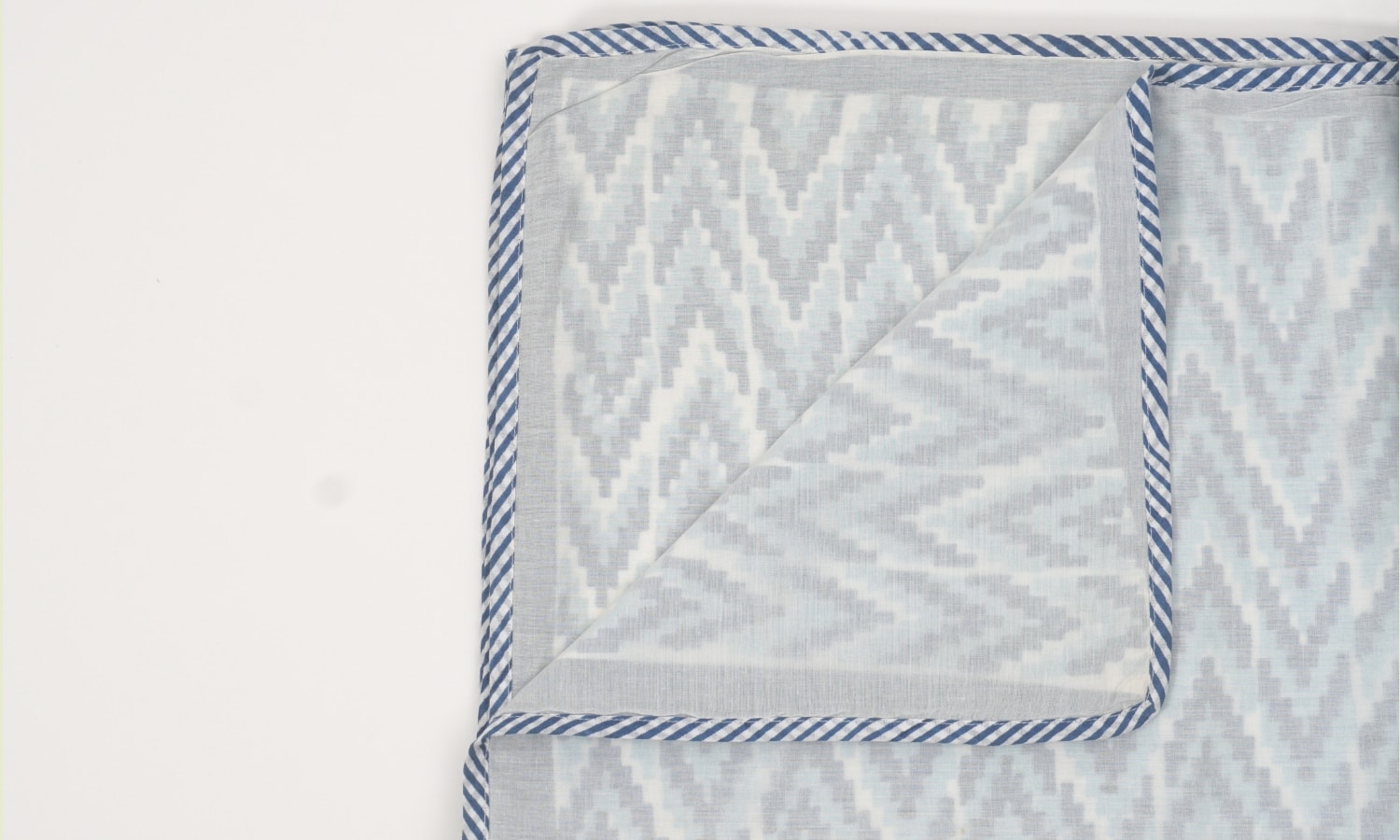 Close-up of hand block print on organic cotton dohar (lightweight cotton quilt) | Myyra Jaipur