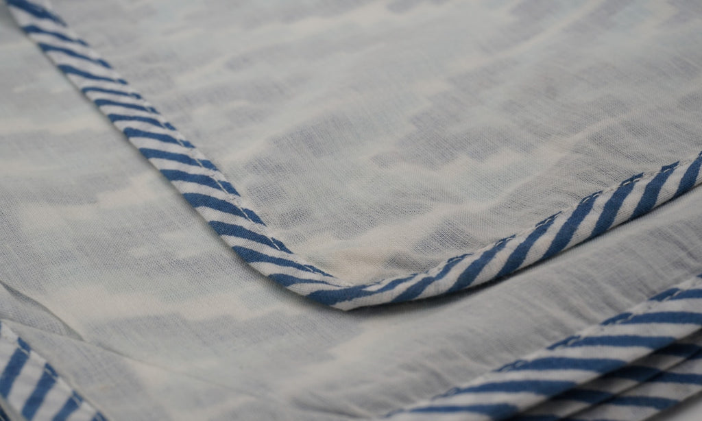 Dohar (lightweight cotton quilt) folded showing pattern repeat of hand block print | Myyra Jaipur