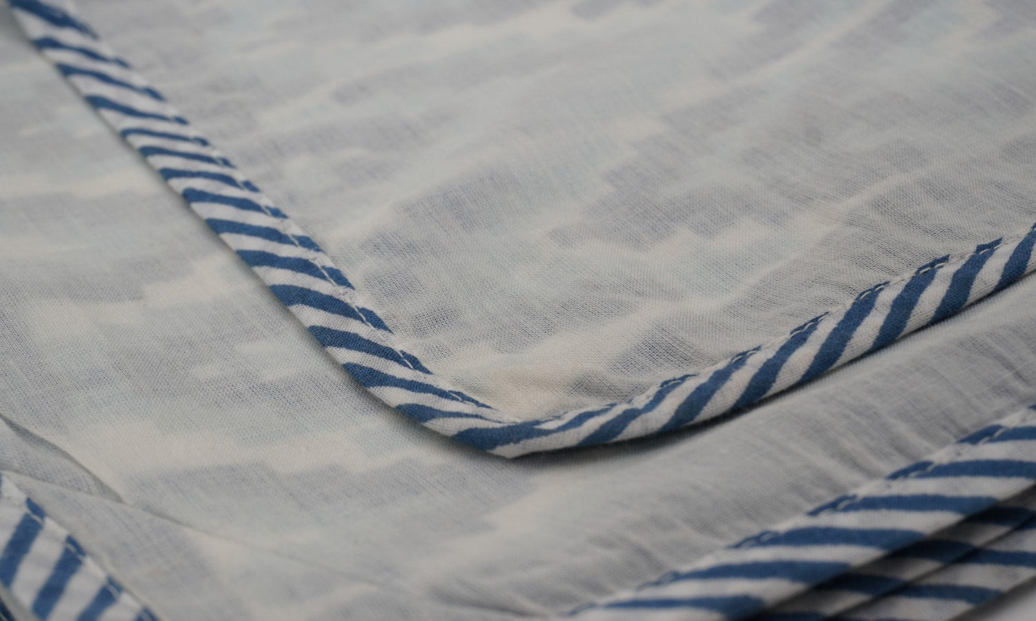 Dohar (lightweight cotton quilt) folded showing pattern repeat of hand block print | Myyra Jaipur