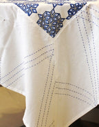 Close-up of kantha hand block print on organic cotton table cover | Myyra Jaipur