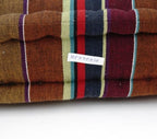 Floor cushion styled view from Myyra Jaipur
