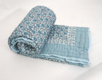 Styled view of hand block printed organic cotton quilt | Myyra Jaipur