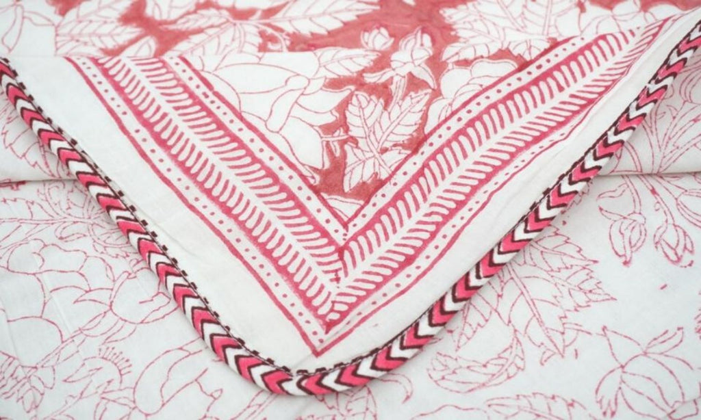 Dohar (lightweight cotton quilt) folded showing pattern repeat of hand block print | Myyra Jaipur