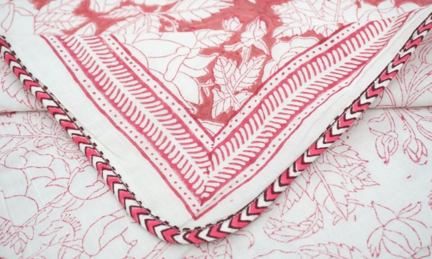 Dohar (lightweight cotton quilt) folded showing pattern repeat of hand block print | Myyra Jaipur