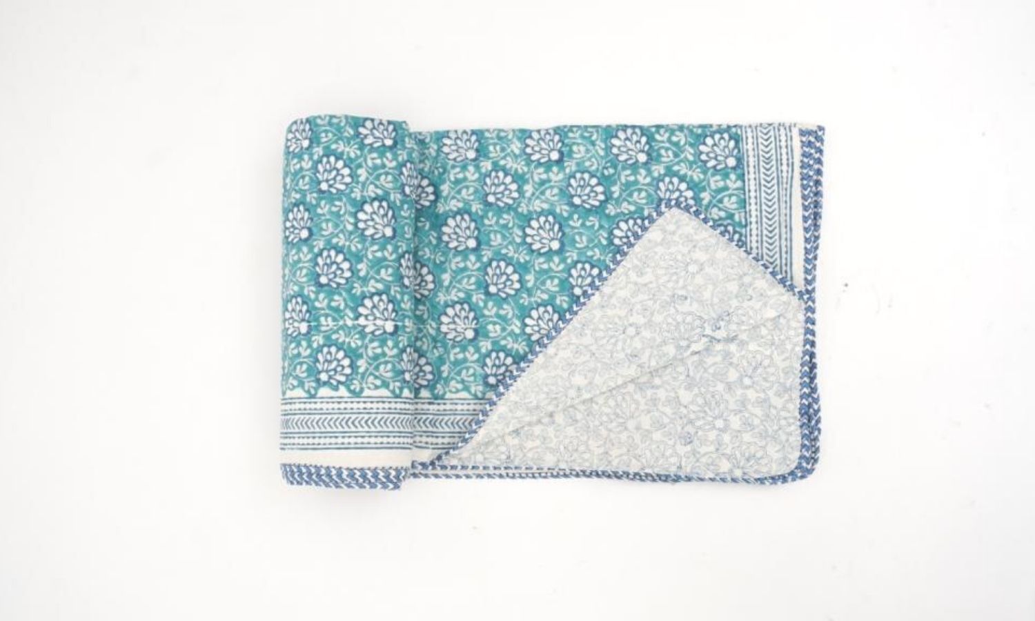 Dohar (lightweight cotton quilt) folded showing pattern repeat of hand block print | Myyra Jaipur