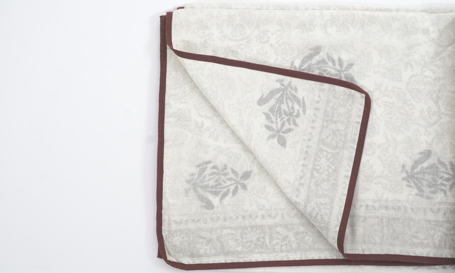 Dohar (lightweight cotton quilt) folded showing pattern repeat of hand block print | Myyra Jaipur