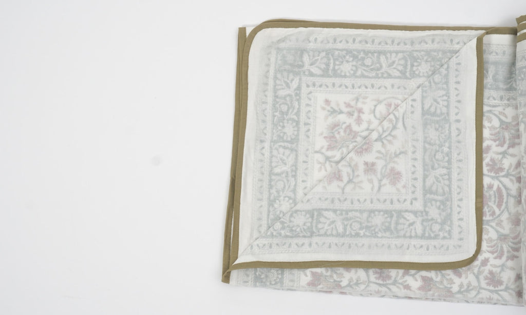 Dohar (lightweight cotton quilt) folded showing pattern repeat of hand block print | Myyra Jaipur