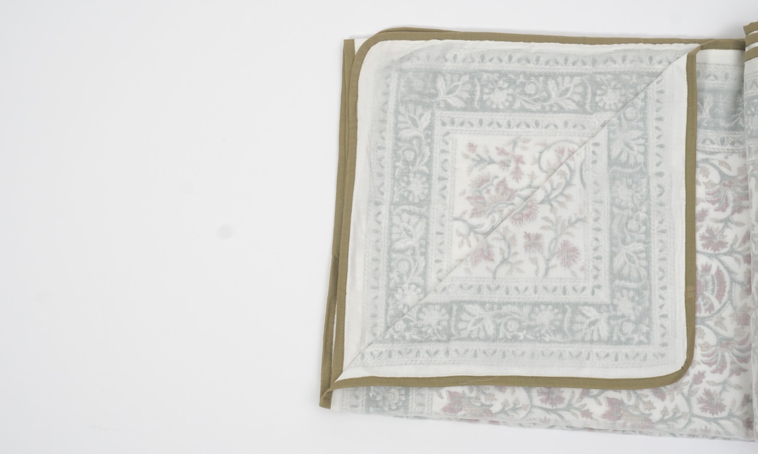 Dohar (lightweight cotton quilt) folded showing pattern repeat of hand block print | Myyra Jaipur