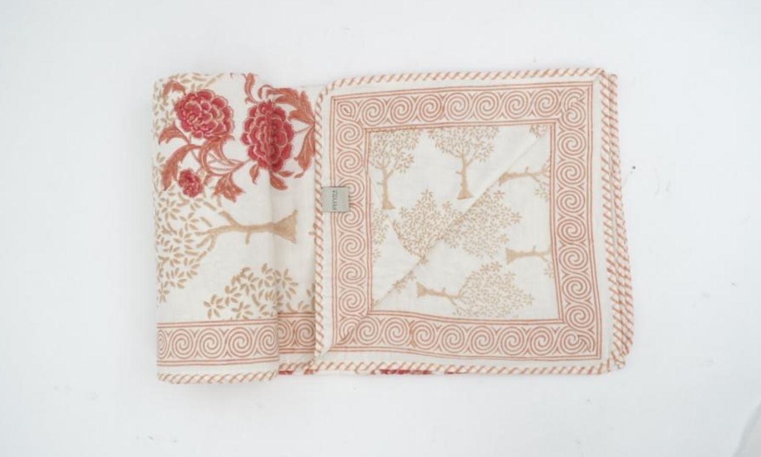 Dohar (lightweight cotton quilt) folded showing pattern repeat of hand block print | Myyra Jaipur