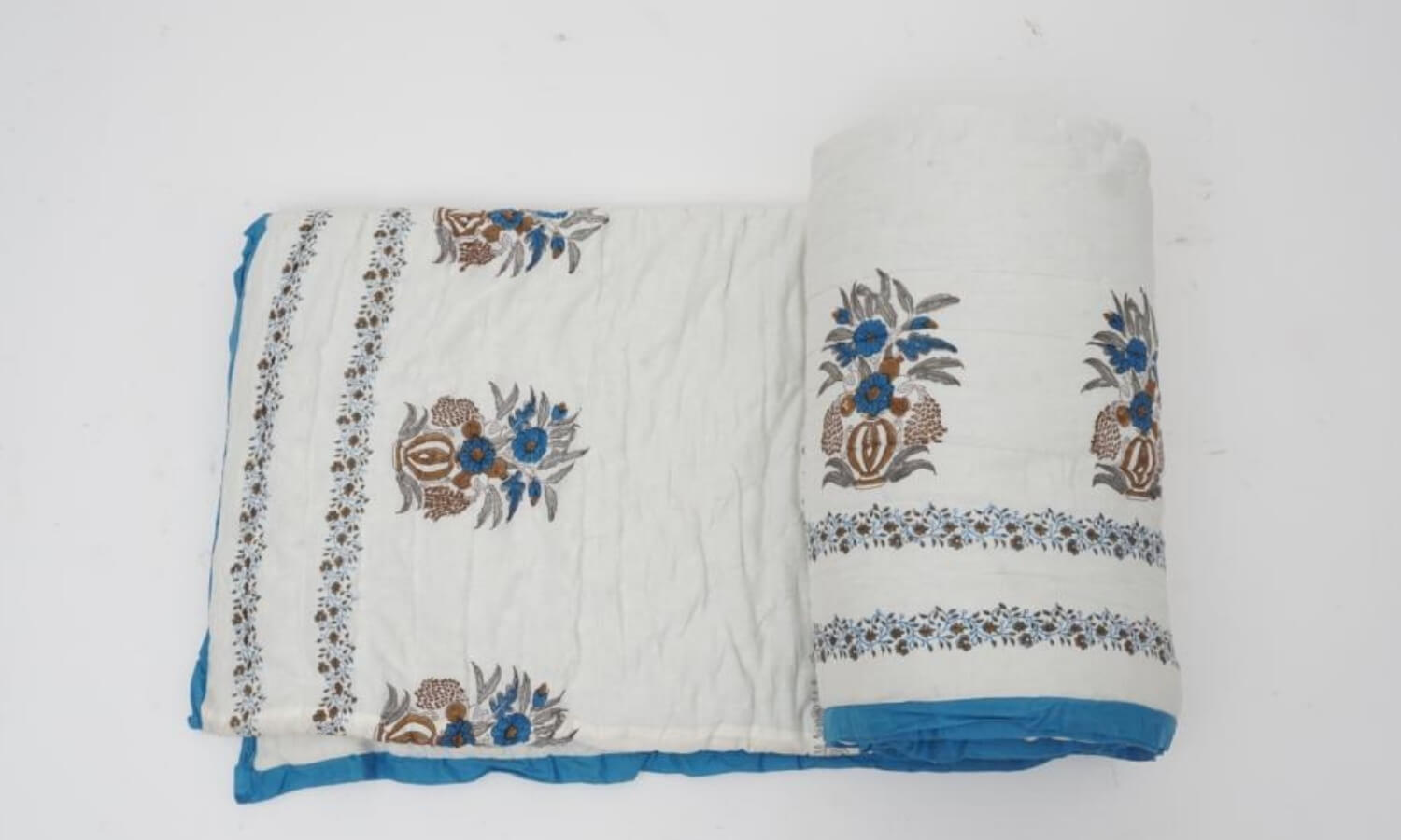 Quilt folded showing pattern repeat of hand block print | Myyra Jaipur