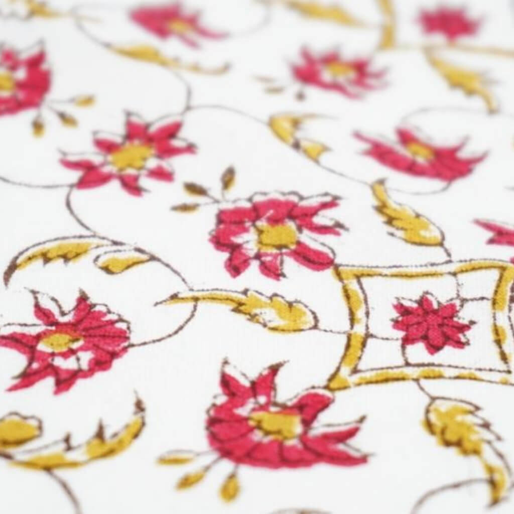 Close-up of hand block print on organic cotton running fabric | Myyra Jaipur