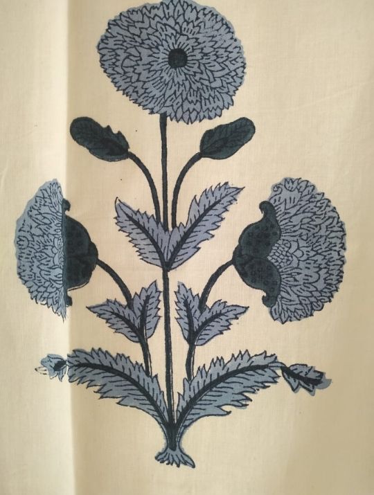 Folded organic cotton curtain showing block printed repeat | Myyra Jaipur