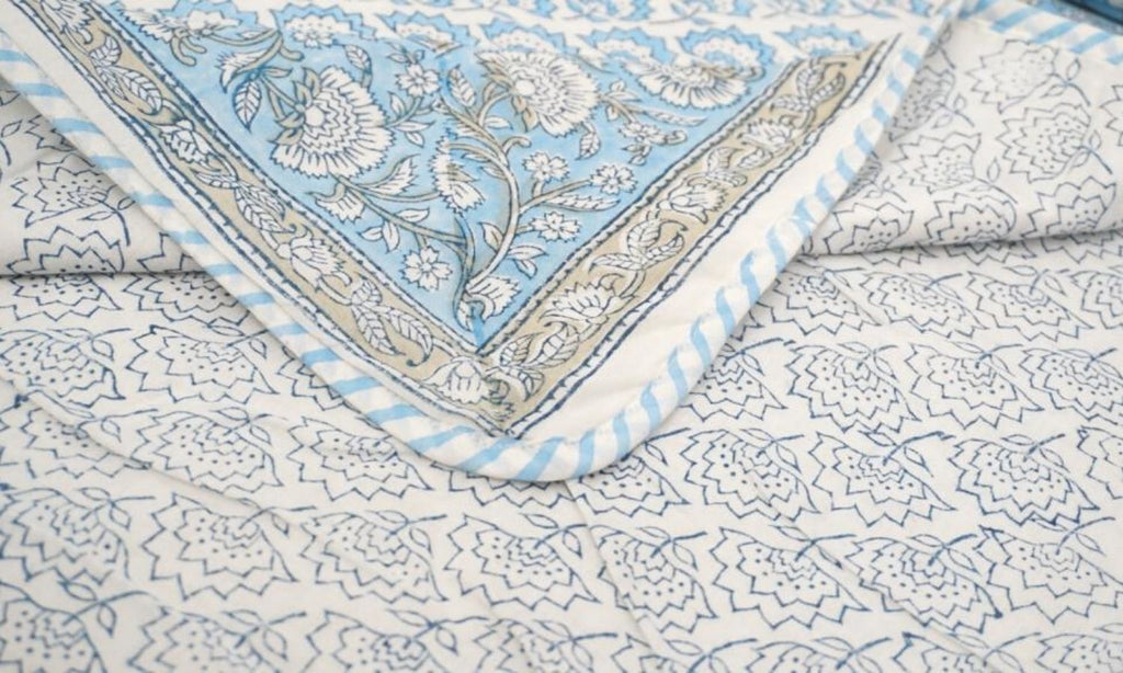 Dohar (lightweight cotton quilt) folded showing pattern repeat of hand block print | Myyra Jaipur