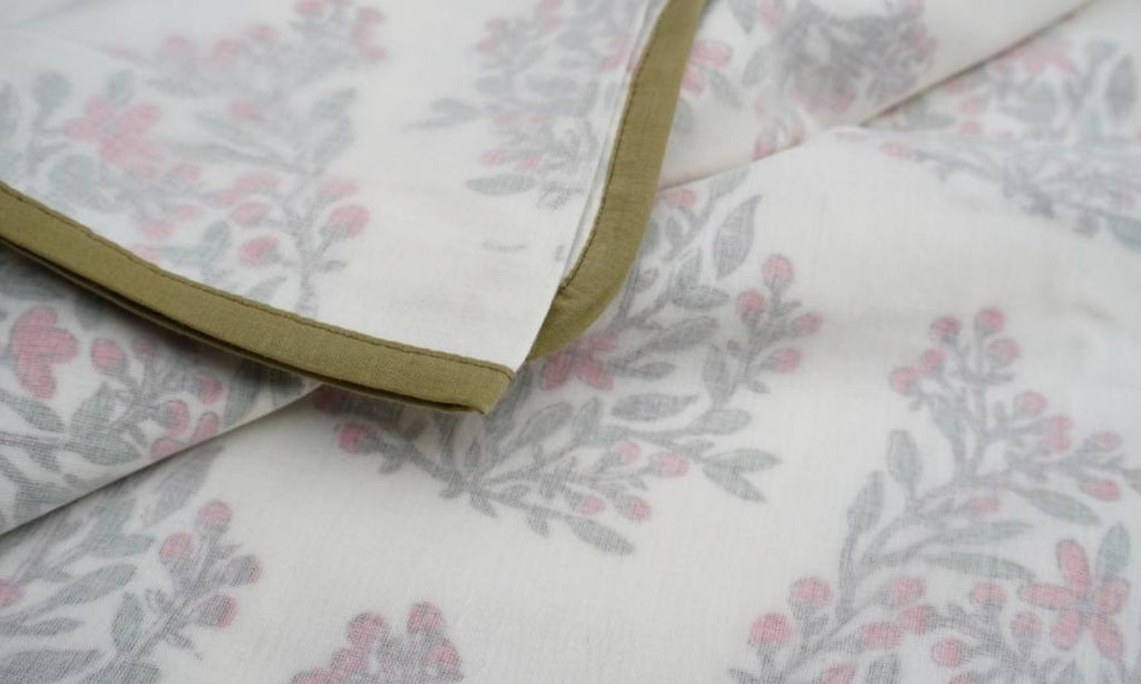 Dohar (lightweight cotton quilt) folded showing pattern repeat of hand block print | Myyra Jaipur