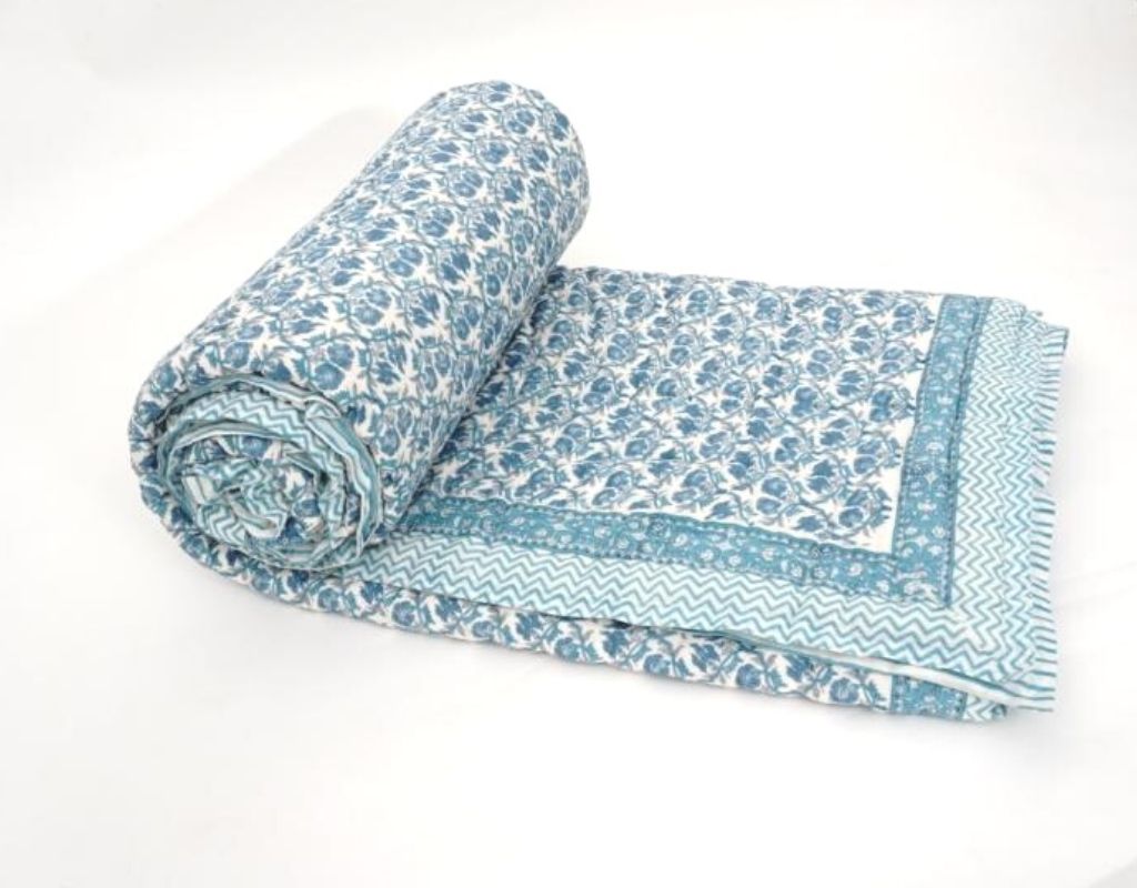 Styled view of hand block printed organic cotton quilt | Myyra Jaipur
