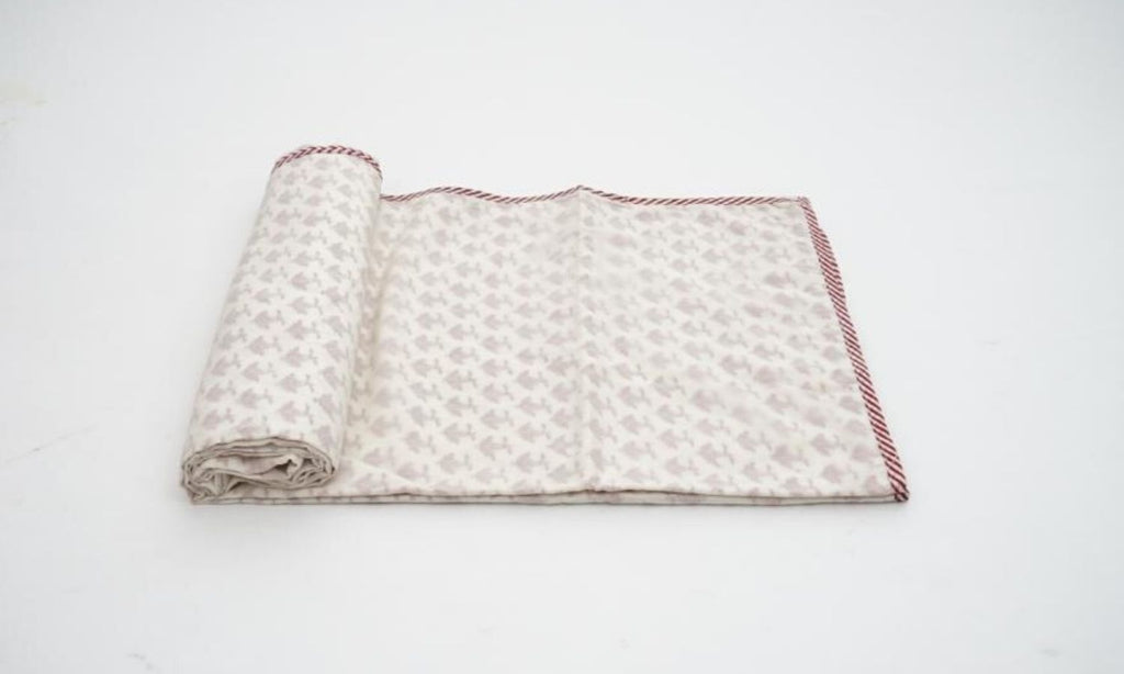 Dohar (lightweight cotton quilt) folded showing pattern repeat of hand block print | Myyra Jaipur