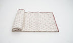 Dohar (lightweight cotton quilt) folded showing pattern repeat of hand block print | Myyra Jaipur
